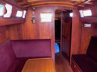 The saloon is warm and cosy with rich mahogany panelling. The head room is over 6ft. The Lewmar skylight hatch in the center of the cabin gives additioal light and ventilation. The cabin is heated by a Eberspacher Airtronic-D2 diesal heater situated in a